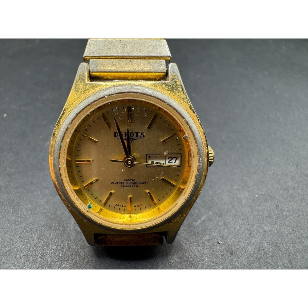 Dakota 3ATM WR Rock Solid Quartz Day/Date Watch Japan Stretch Band Gold Tone